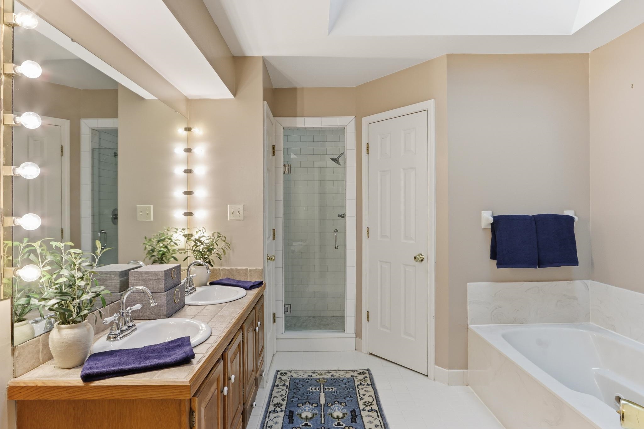 8372 Bazemore Road Cordova, TN 38018 - Photo 23 of 40 a bathroom with a tub sink and mirror