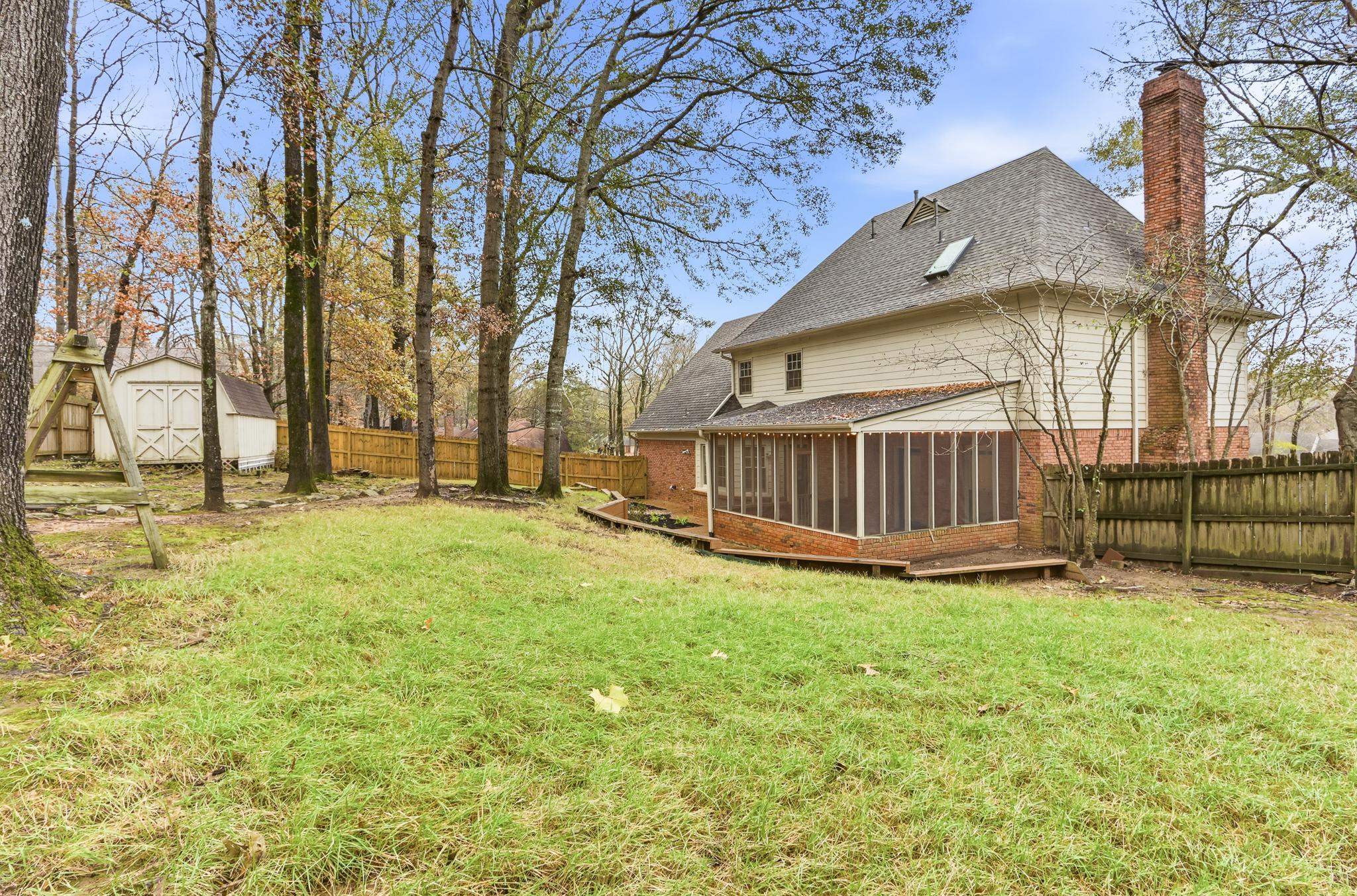 8372 Bazemore Road Cordova, TN 38018 - Photo 33 of 40 a view of backyard with wooden fence and large trees