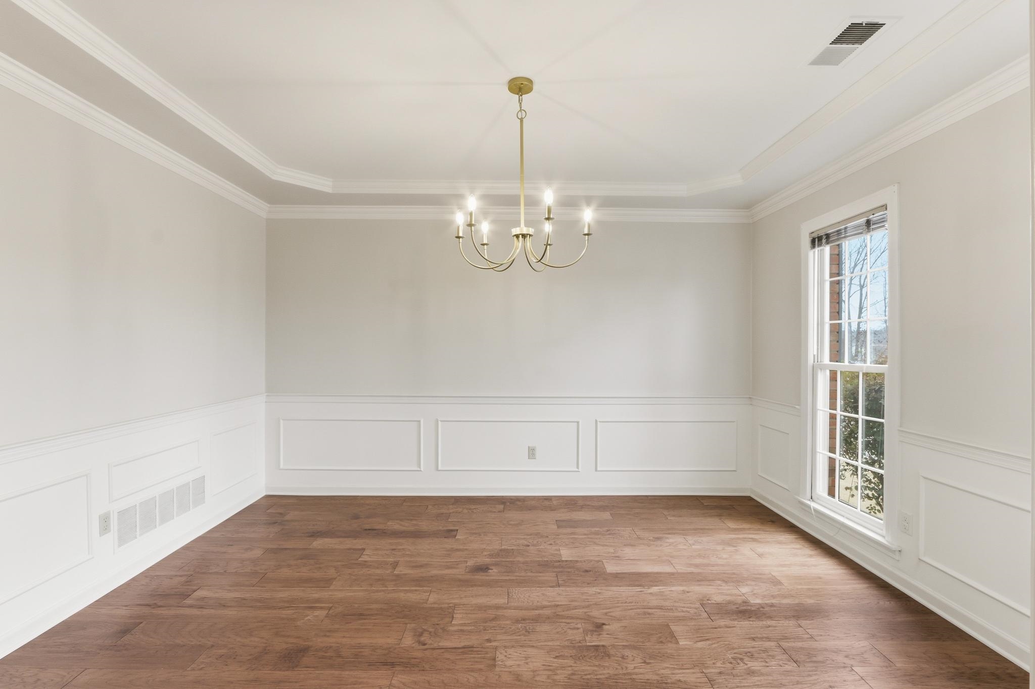 8372 Bazemore Road Cordova, TN 38018 - Photo 6 of 40 a view of empty room with wooden floor and fan