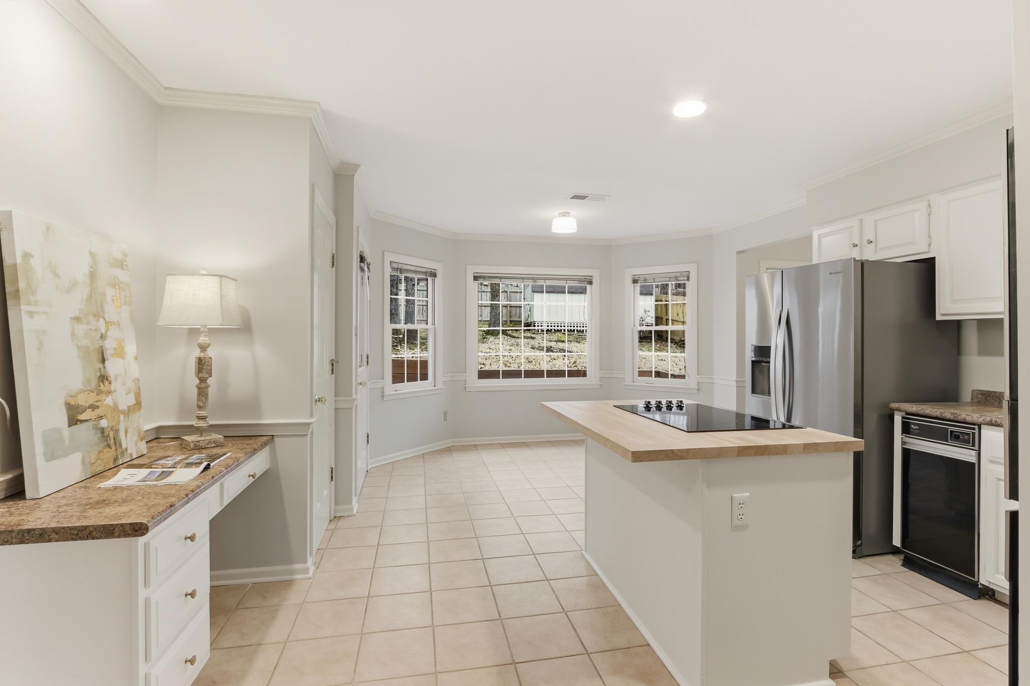8372 Bazemore Road Cordova, TN 38018 - Photo 8 of 40 a large kitchen with a sink and refrigerator