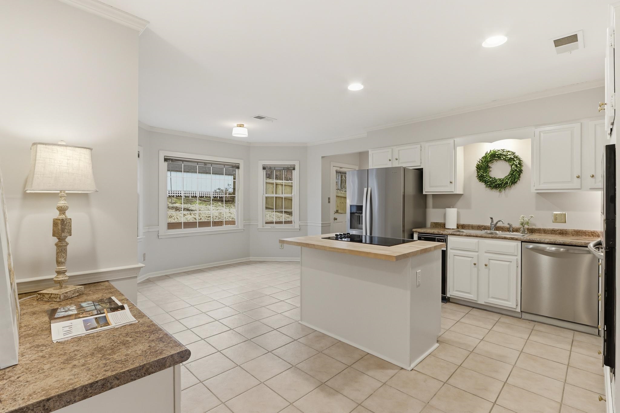 8372 Bazemore Road Cordova, TN 38018 - Photo 9 of 40 a kitchen with granite countertop a sink and a stove top oven
