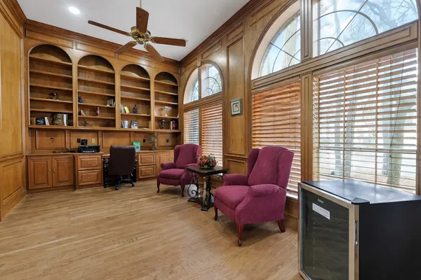 a view of a livingroom with furniture and a large window
