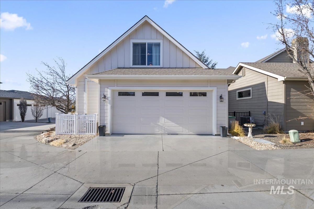 2856 South Wise Way Boise, ID 83716 - Photo 38 of 47 View of front facade featuring board and batten siding, a garage, concrete driveway, and a shingled roof