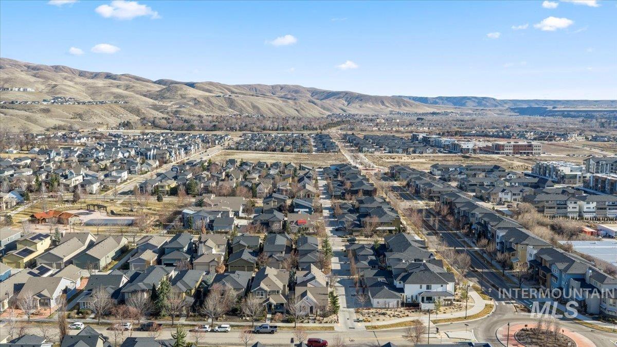 2856 South Wise Way Boise, ID 83716 - Photo 42 of 47 Aerial view of property's location featuring a mountain backdrop and nearby suburban area