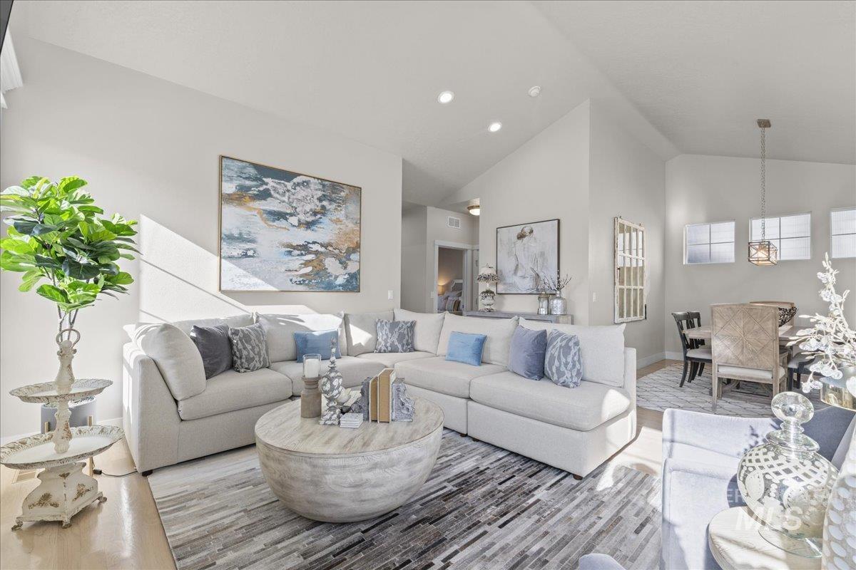 2856 South Wise Way Boise, ID 83716 - Photo 10 of 47 Living area featuring vaulted ceiling and recessed lighting