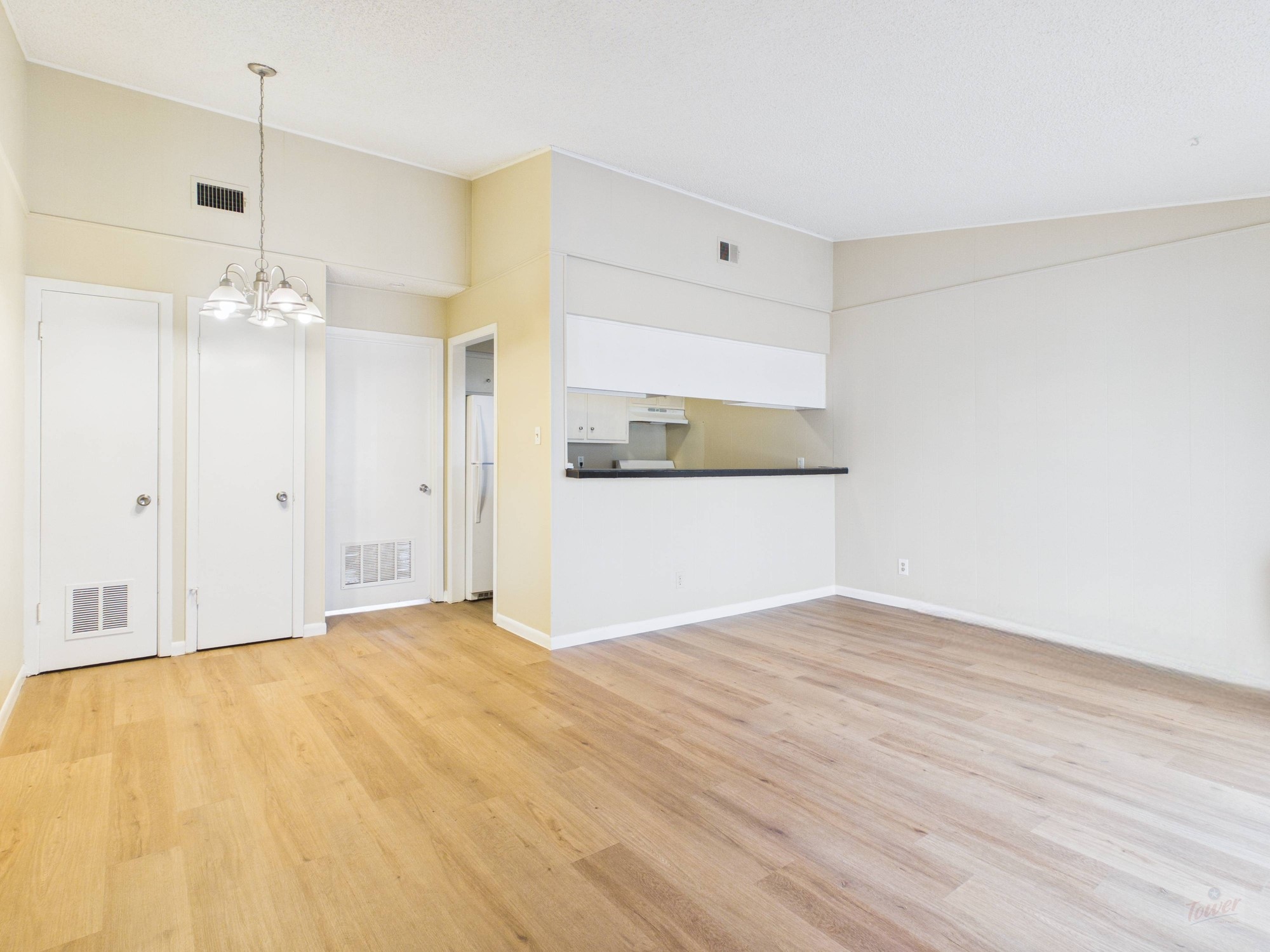 616 West 51st Street, Unit 101 Austin, TX 78751 - Photo 2 of 16 a view of a kitchen with wooden floor