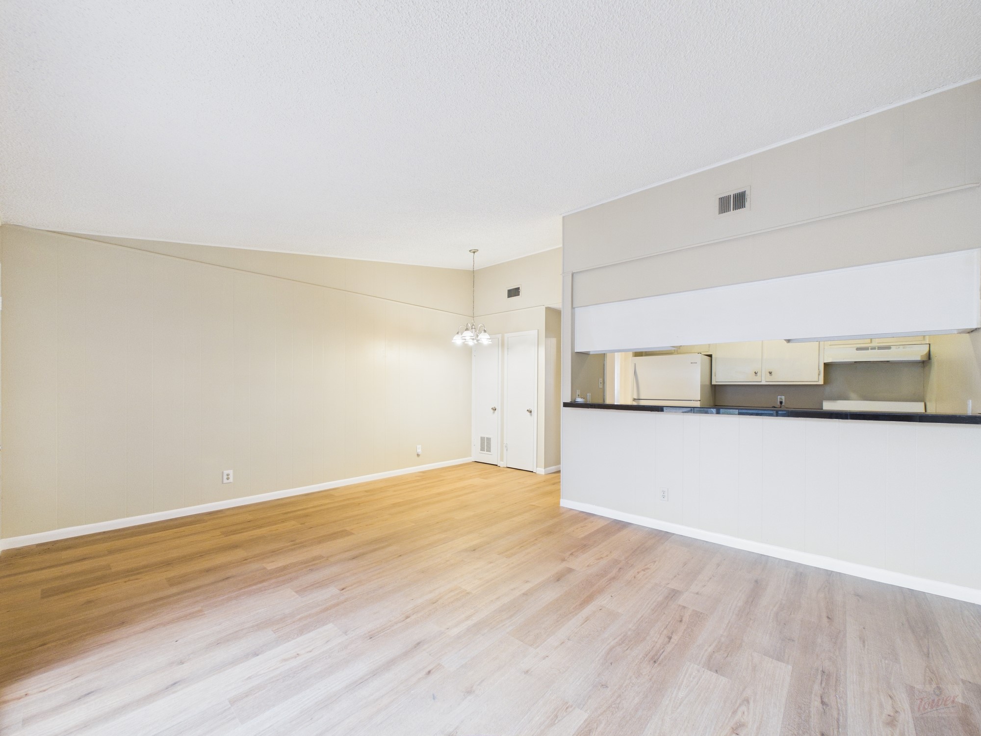 616 West 51st Street, Unit 101 Austin, TX 78751 - Photo 7 of 16 a view of empty room with wooden floor