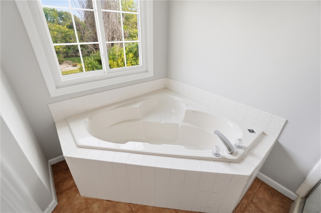 10 Chase Court Springboro, OH 45066 - Photo 39 of 75 Relax and unwind in this inviting corner soaking tub, perfectly positioned by a sunlit window.