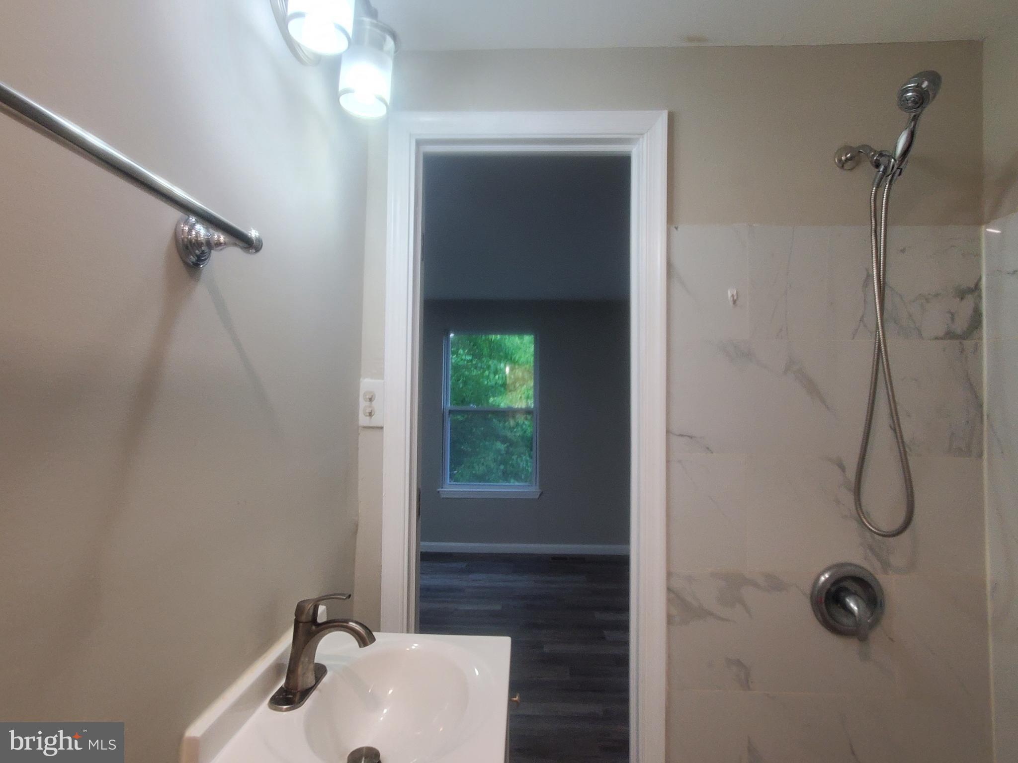14813 Hammersmith Circle Silver Spring, MD 20906 - Photo 16 of 36 a bathroom with a sink and a mirror