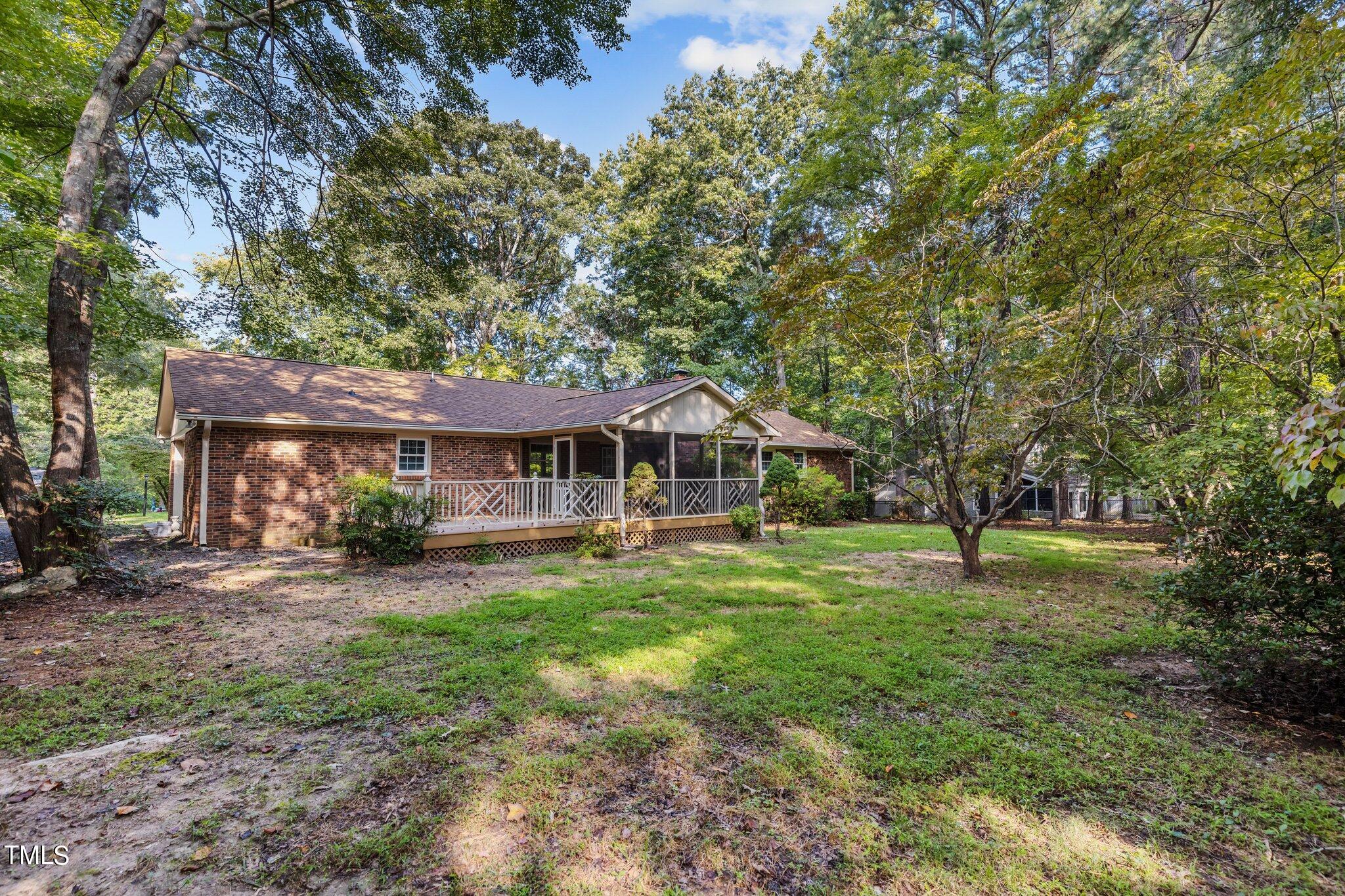 5110 Raintree Road Durham, NC 27712 - Photo 19 of 23 a backyard of a house with table and chairs