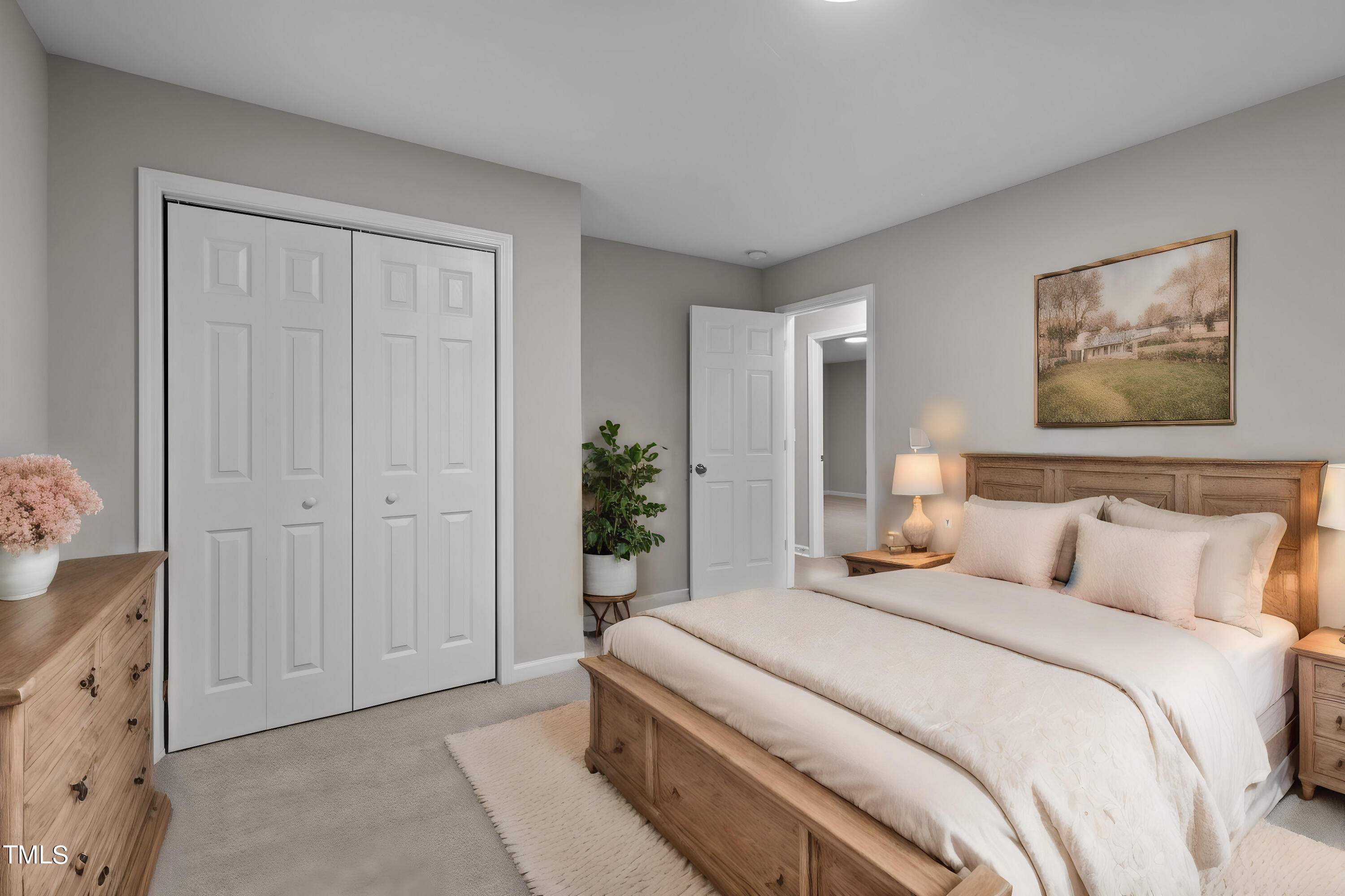 5110 Raintree Road Durham, NC 27712 - Photo 9 of 23 a bedroom with a bed and a painting on the wall