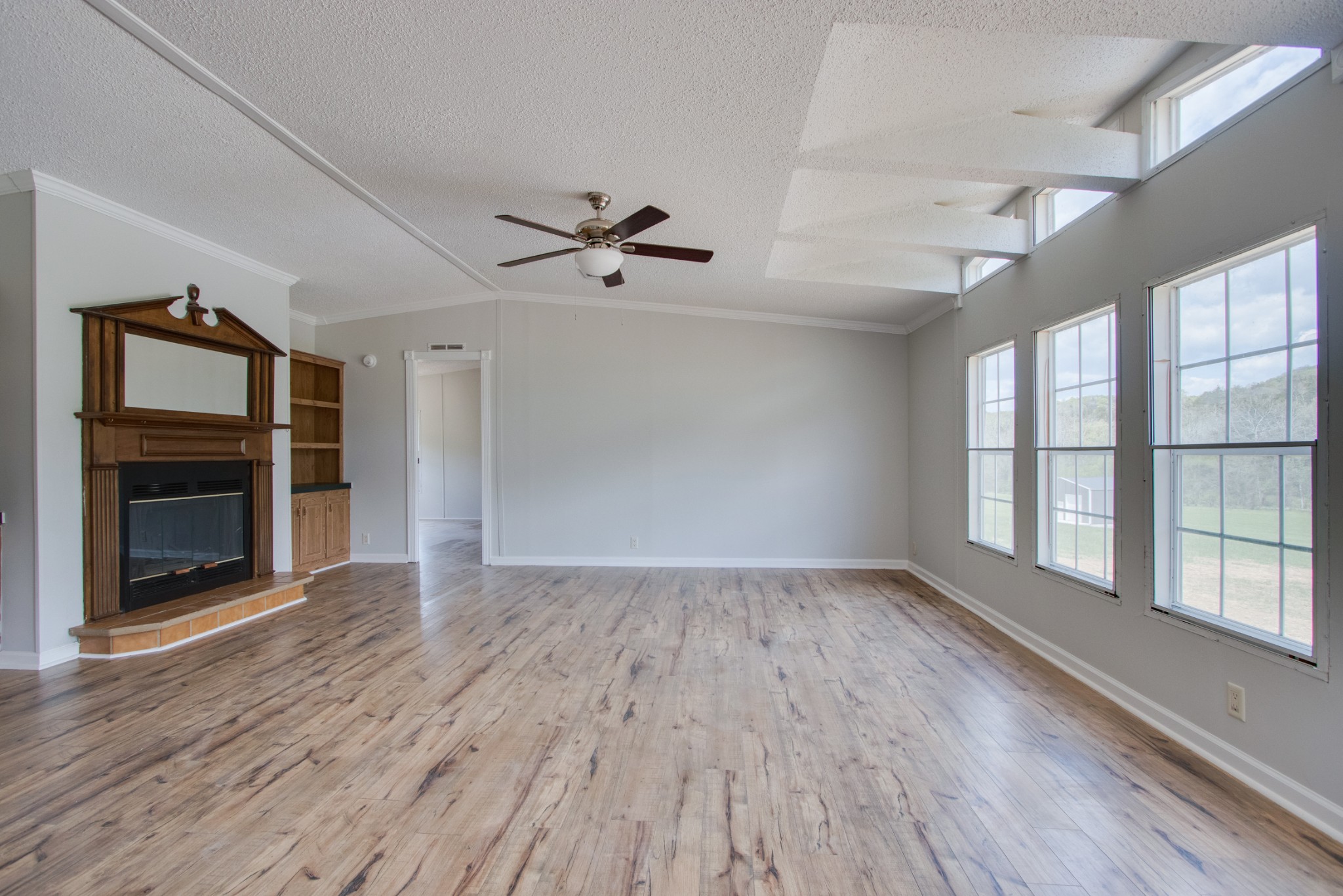 24 Young Road Buffalo Valley, TN 38548 - Photo 5 of 33 wooden floor in an empty room with a window