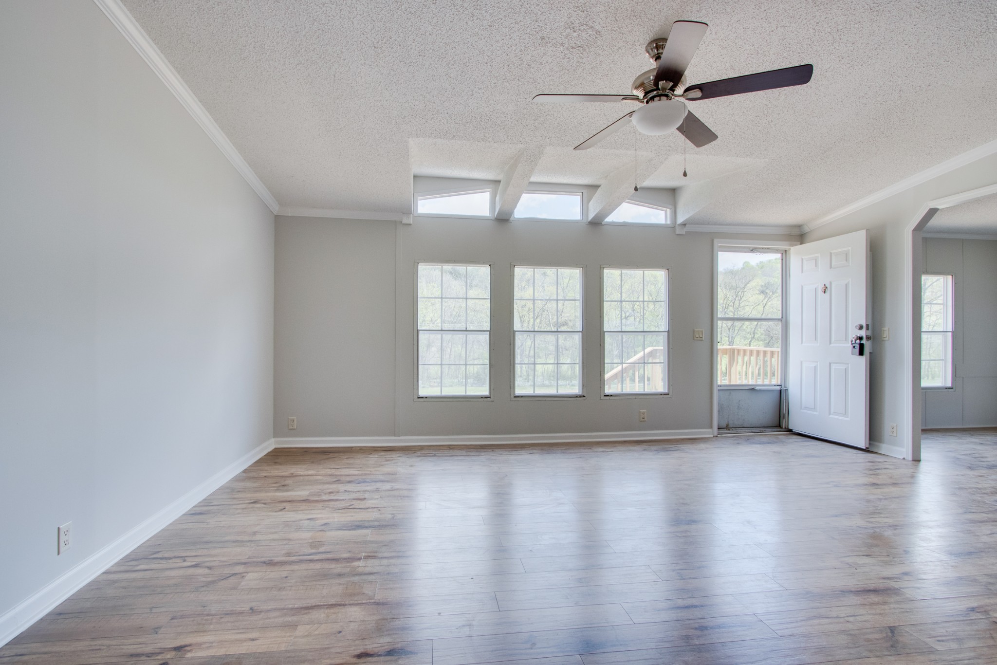 24 Young Road Buffalo Valley, TN 38548 - Photo 8 of 33 a view of an empty room with a window and wooden floor