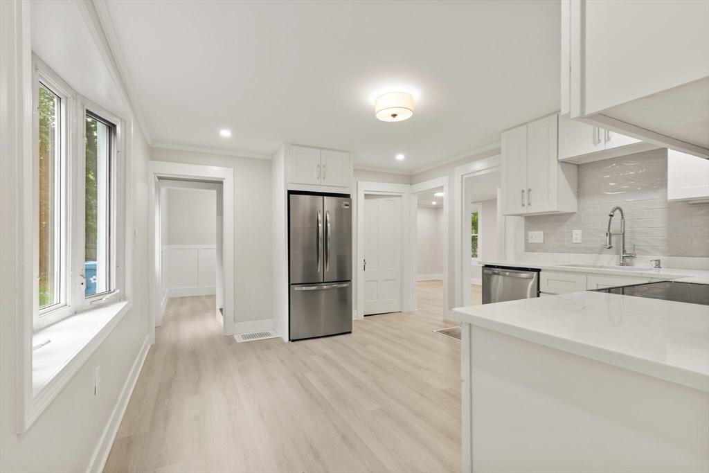 25 Norfolk Street Canton, MA 02021 - Photo 13 of 31 a view of a kitchen with a sink refrigerator and a window