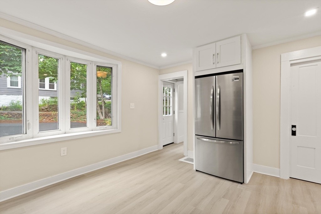 25 Norfolk Street Canton, MA 02021 - Photo 14 of 31 a kitchen with stainless steel appliances a refrigerator and wooden floor