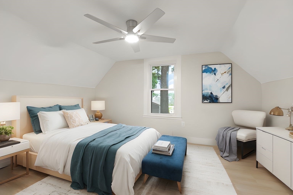 25 Norfolk Street Canton, MA 02021 - Photo 20 of 31 a bedroom with furniture and a chandelier