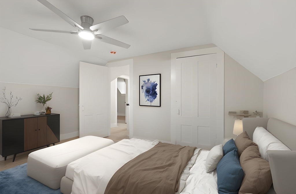 25 Norfolk Street Canton, MA 02021 - Photo 23 of 31 a bedroom with a bed and a chandelier