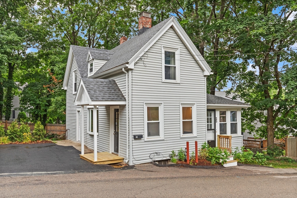 25 Norfolk Street Canton, MA 02021 - Photo 28 of 31 a view of a house with a small yard plants and a large tree