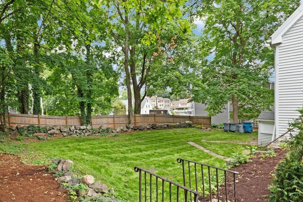 25 Norfolk Street Canton, MA 02021 - Photo 6 of 31 a view of a house with backyard and a tree