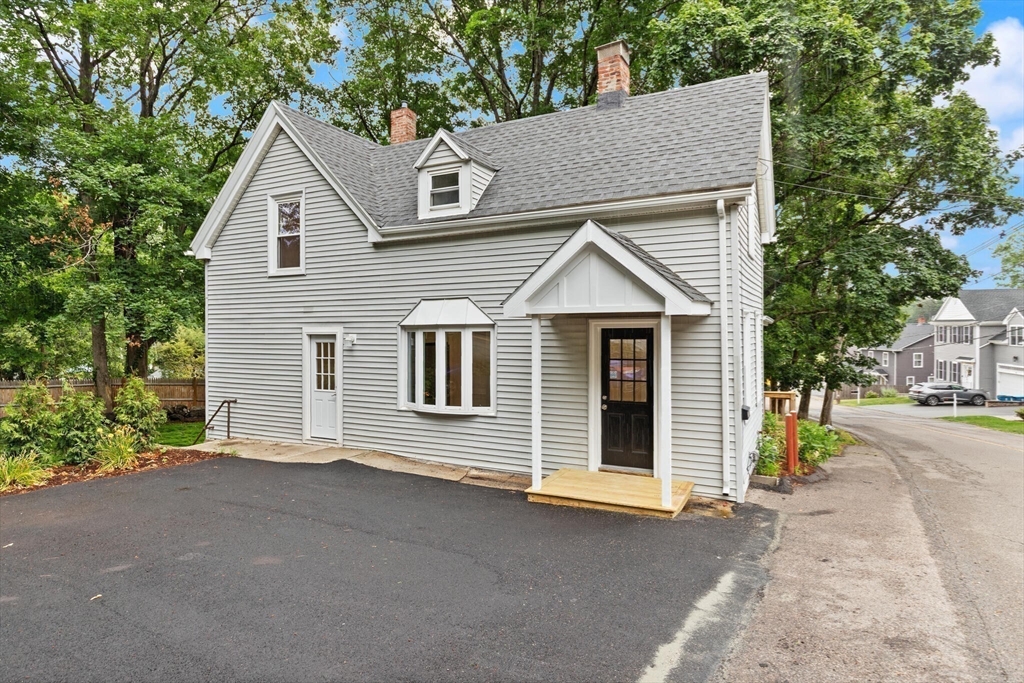25 Norfolk Street Canton, MA 02021 - Photo 9 of 31 a view of a house with a yard and garage