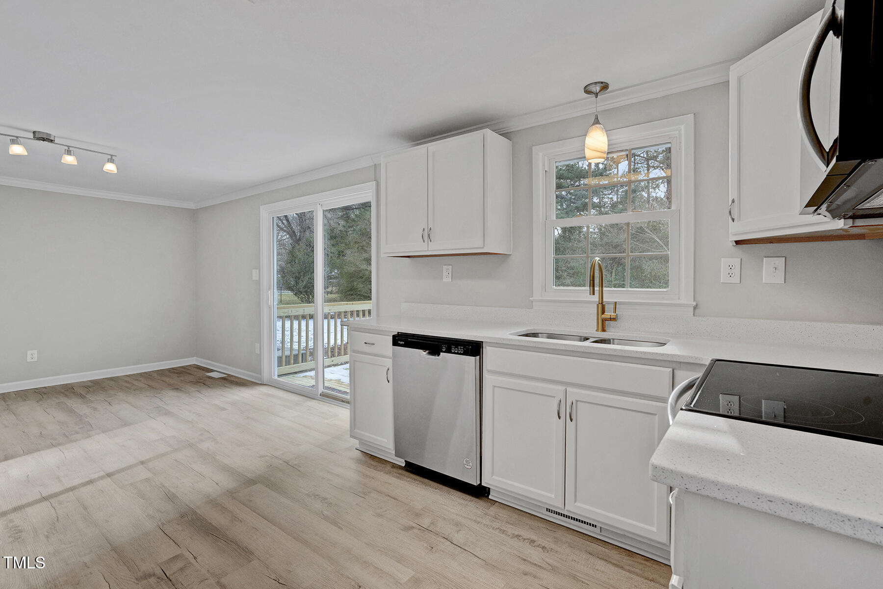 7516 Fox Road Raleigh, NC 27616 - Photo 14 of 31 a kitchen with a sink cabinets and window