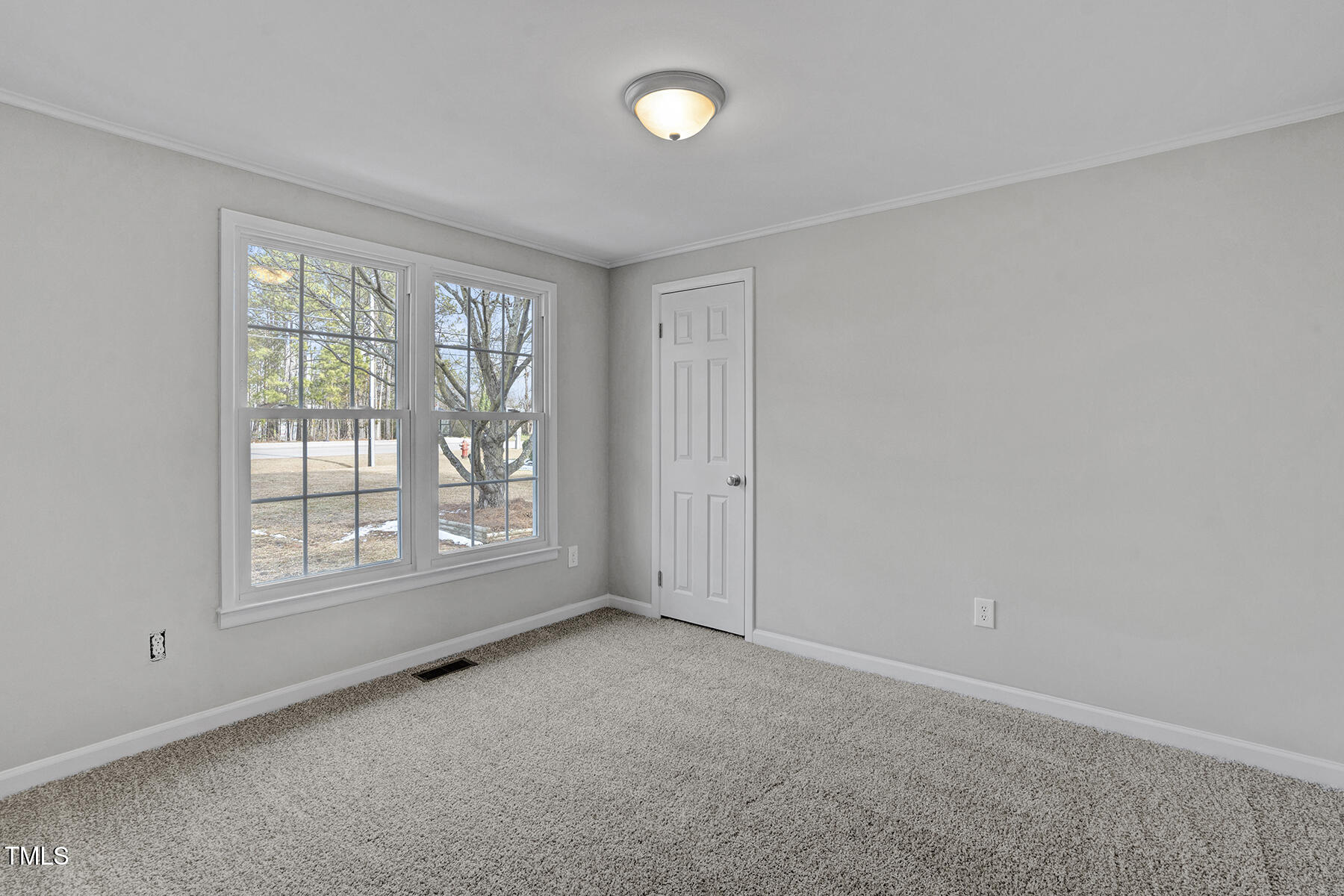 7516 Fox Road Raleigh, NC 27616 - Photo 15 of 31 an empty room with windows and closet