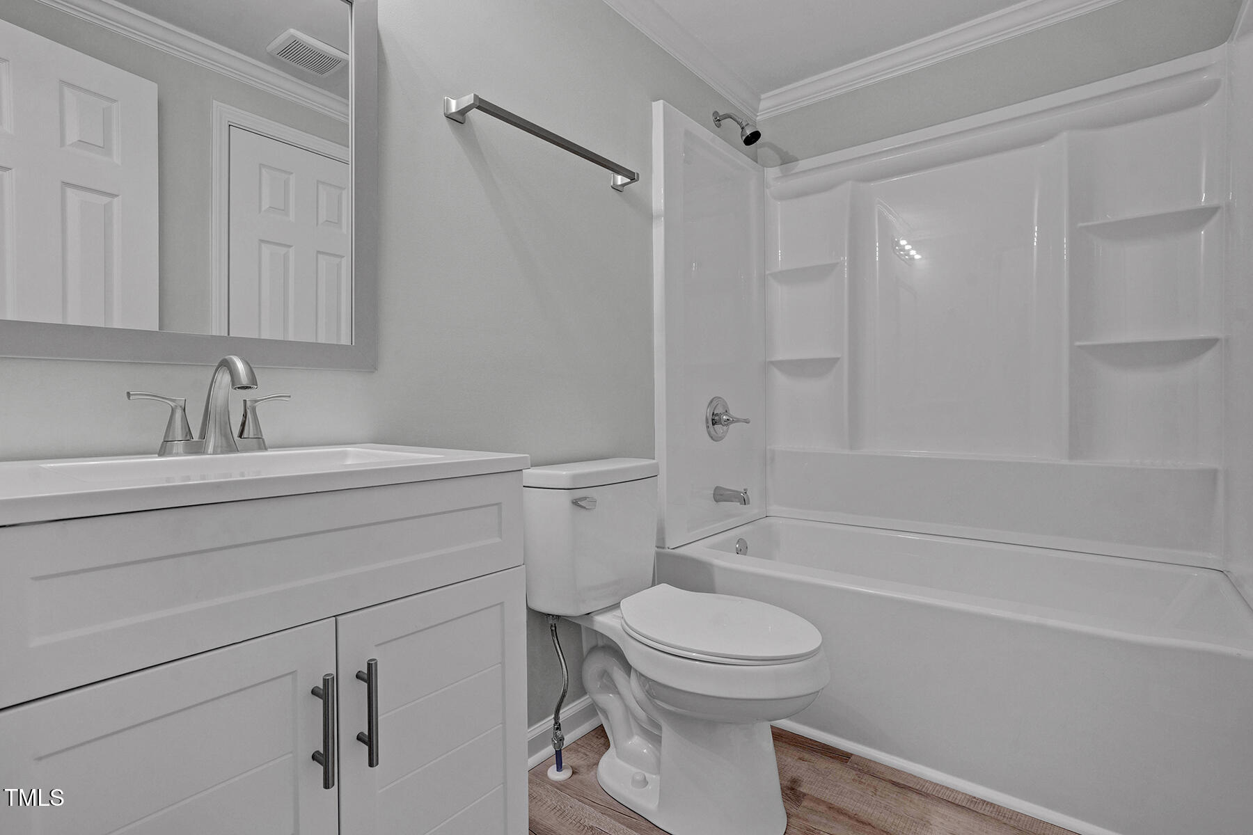 7516 Fox Road Raleigh, NC 27616 - Photo 17 of 31 a bathroom with a sink a toilet and shower