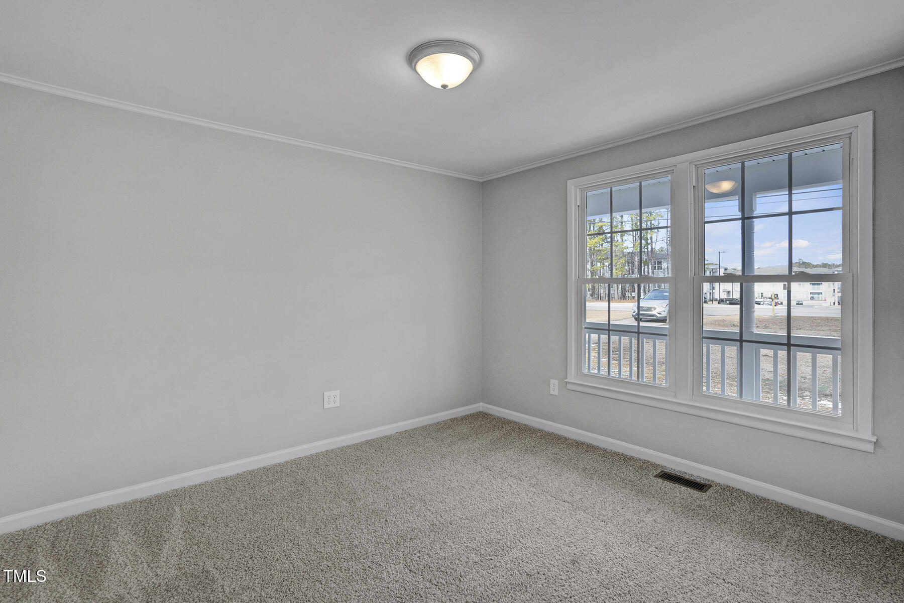 7516 Fox Road Raleigh, NC 27616 - Photo 18 of 31 an empty room with a empty space and windows