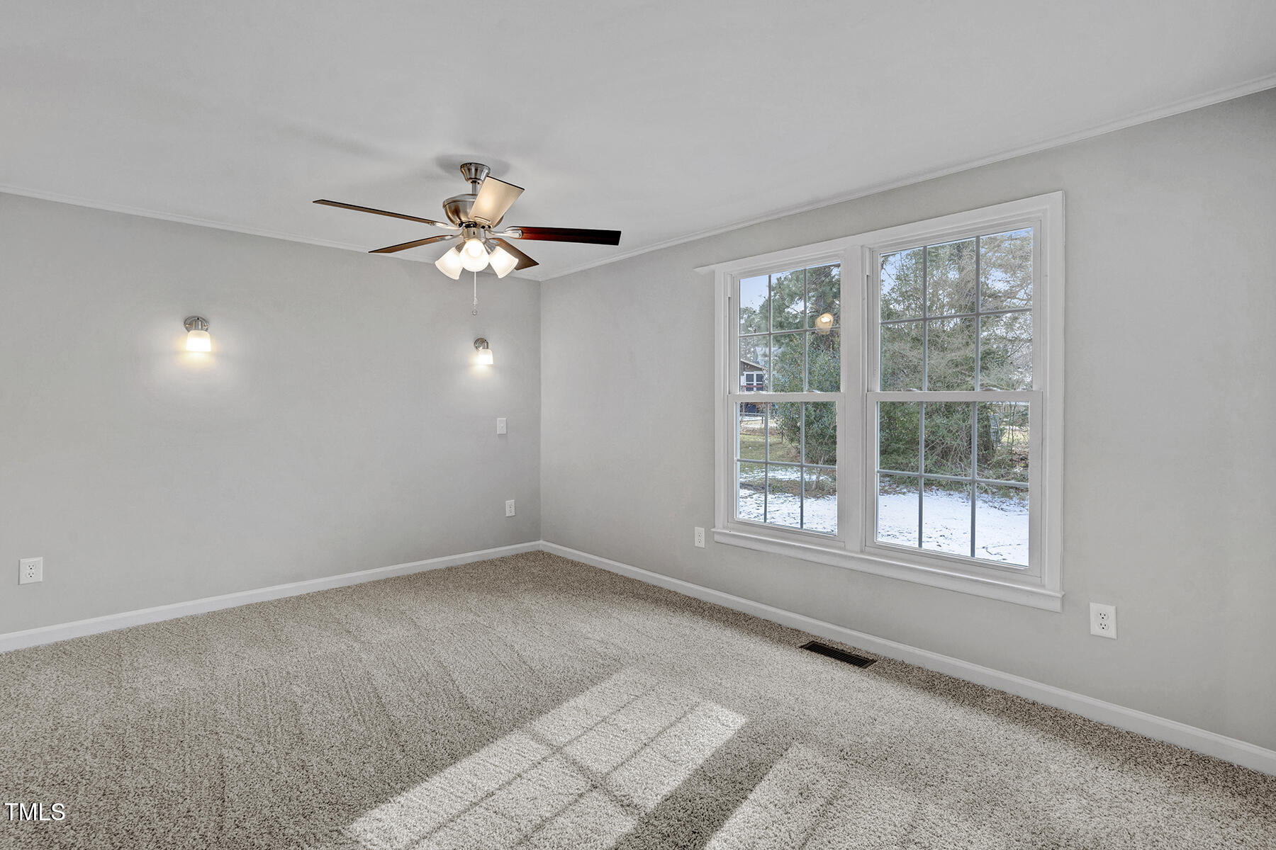 7516 Fox Road Raleigh, NC 27616 - Photo 20 of 31 a view of an empty room with a window