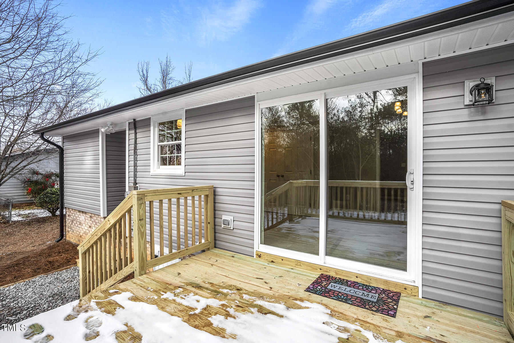 7516 Fox Road Raleigh, NC 27616 - Photo 25 of 31 a view of a porch with wooden floor and fence