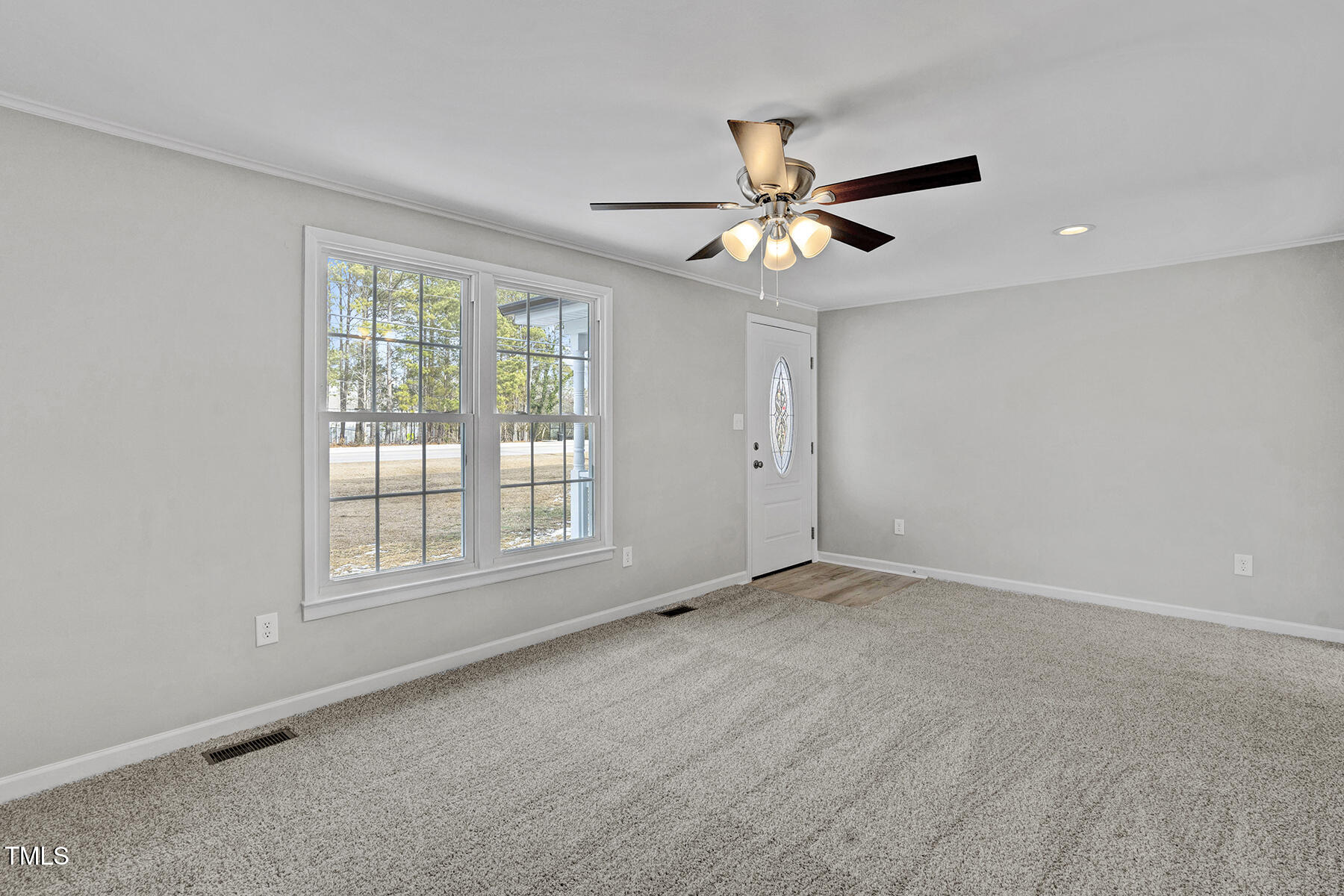 7516 Fox Road Raleigh, NC 27616 - Photo 7 of 31 a view of an empty room with a window