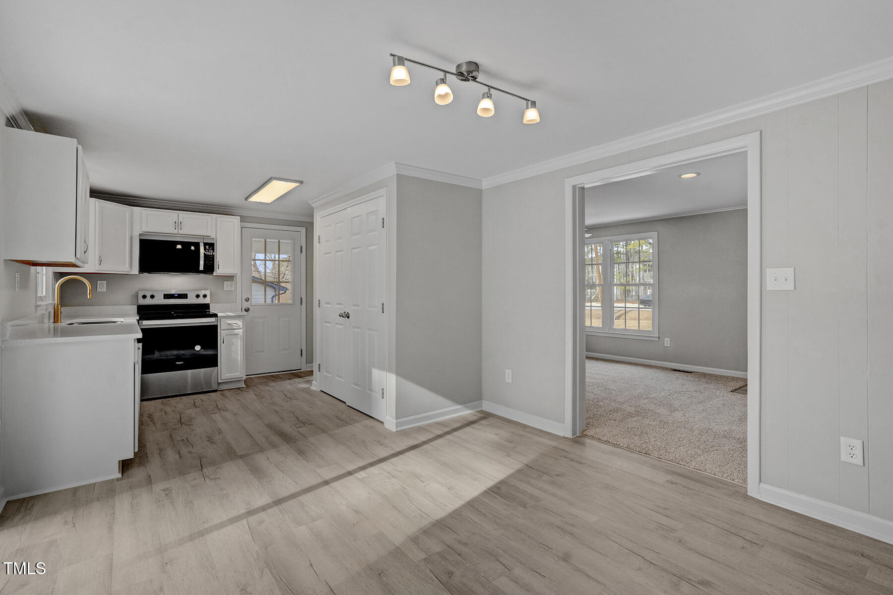 7516 Fox Road Raleigh, NC 27616 - Photo 10 of 31 a view of a kitchen with microwave and refrigerator