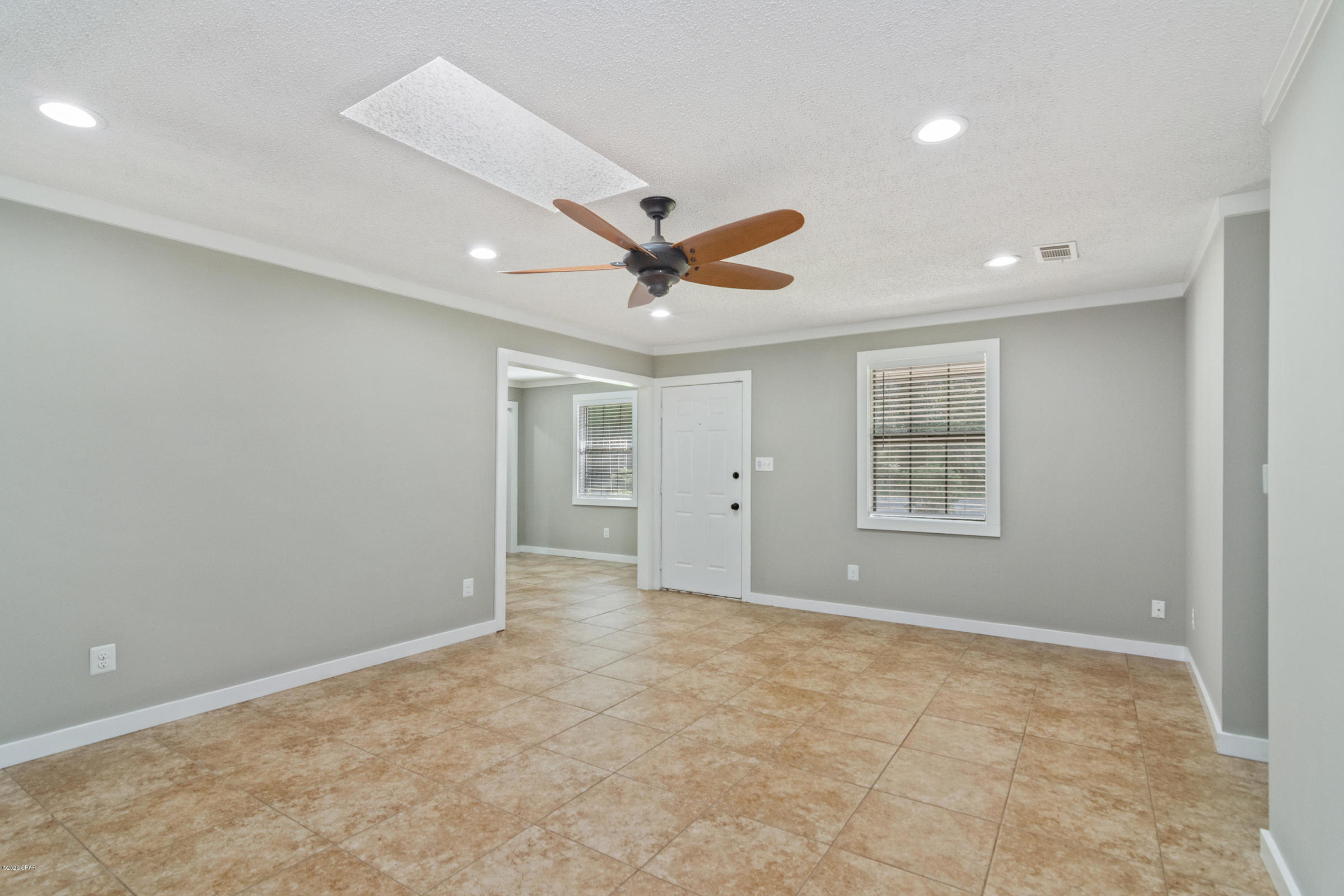 3057 Auburn Road Crestview, FL 32539 - Photo 8 of 30 an empty room with ceiling fan and windows