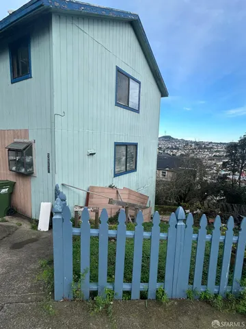 a front view of a house with mountain view