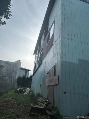 a view of backyard with plants and outdoor seating