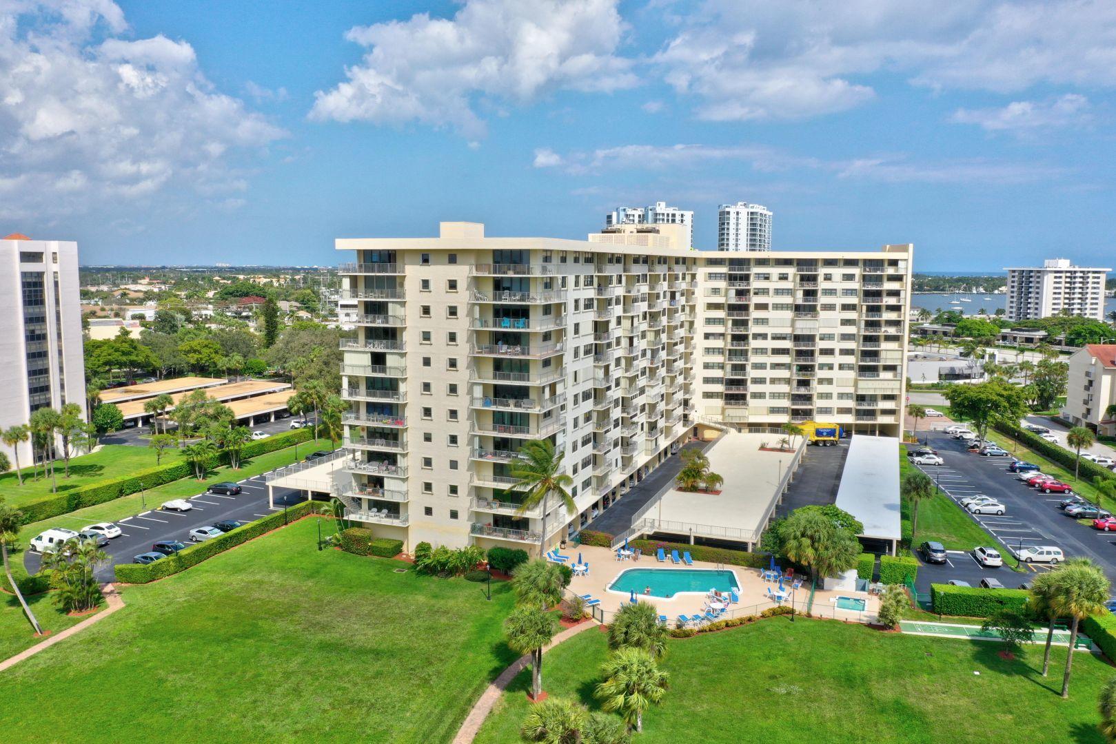 336 Golfview Road, Unit 601 North Palm Beach, FL 33408 - Photo 26 of 28 a view of building with yard