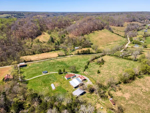 an aerial view of house with yard