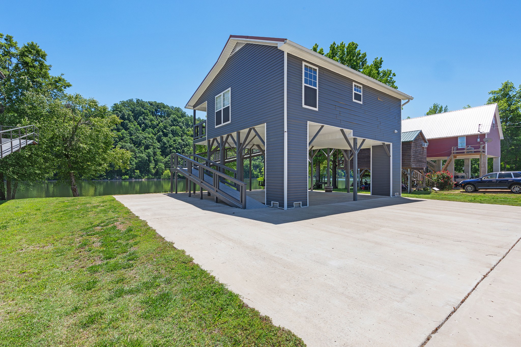 958 Pevahouse Camp Lane Decaturville, TN 38329 - Photo 30 of 32 a front view of a house with a yard