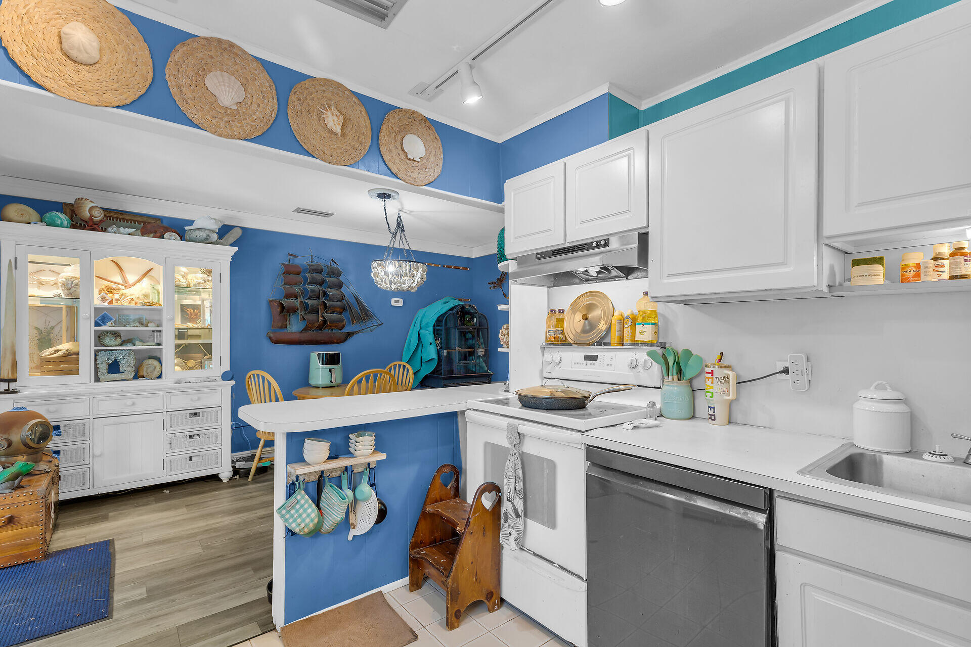 30 Jewfish Avenue Key Largo, FL 33037 - Photo 16 of 43 a kitchen with stainless steel appliances granite countertop a sink and cabinets