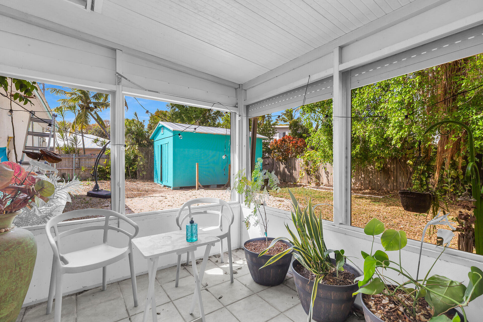 30 Jewfish Avenue Key Largo, FL 33037 - Photo 23 of 43 a living room with patio furniture and garden view