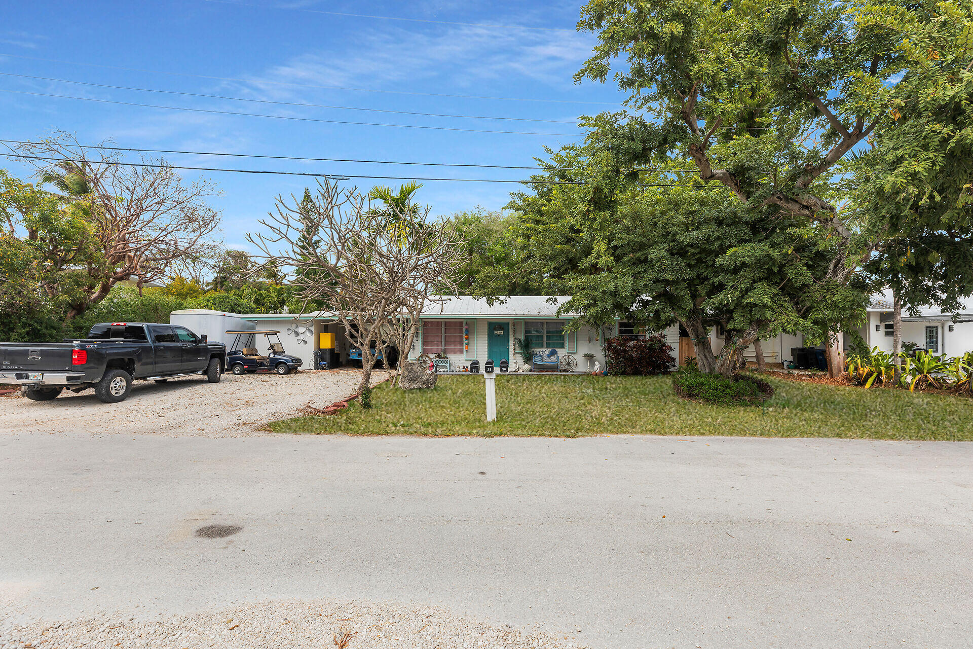 30 Jewfish Avenue Key Largo, FL 33037 - Photo 36 of 43 a view of street with parked cars