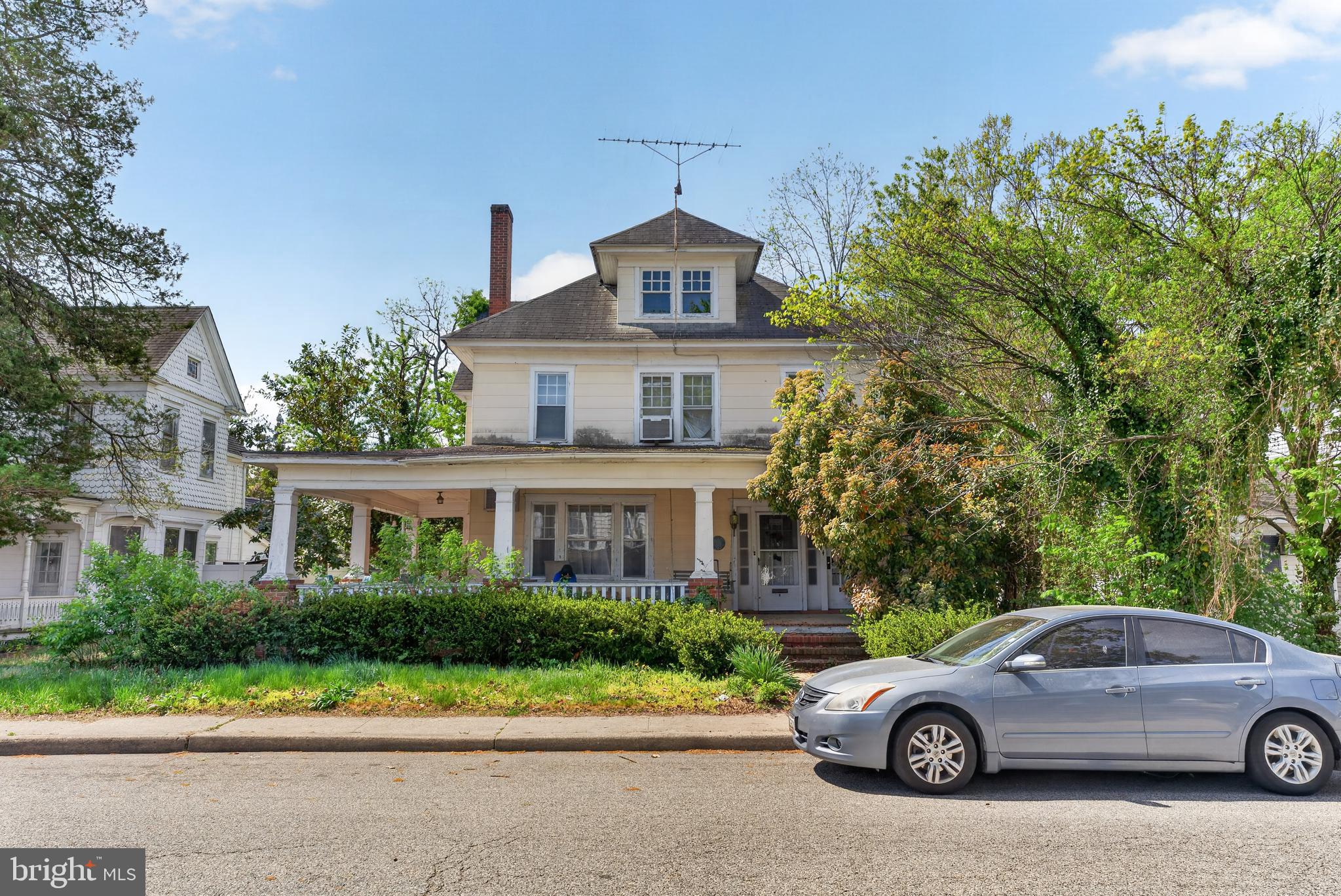 522 Market Street Denton, MD 21629 - Photo 2 of 49 a car parked in front of a house