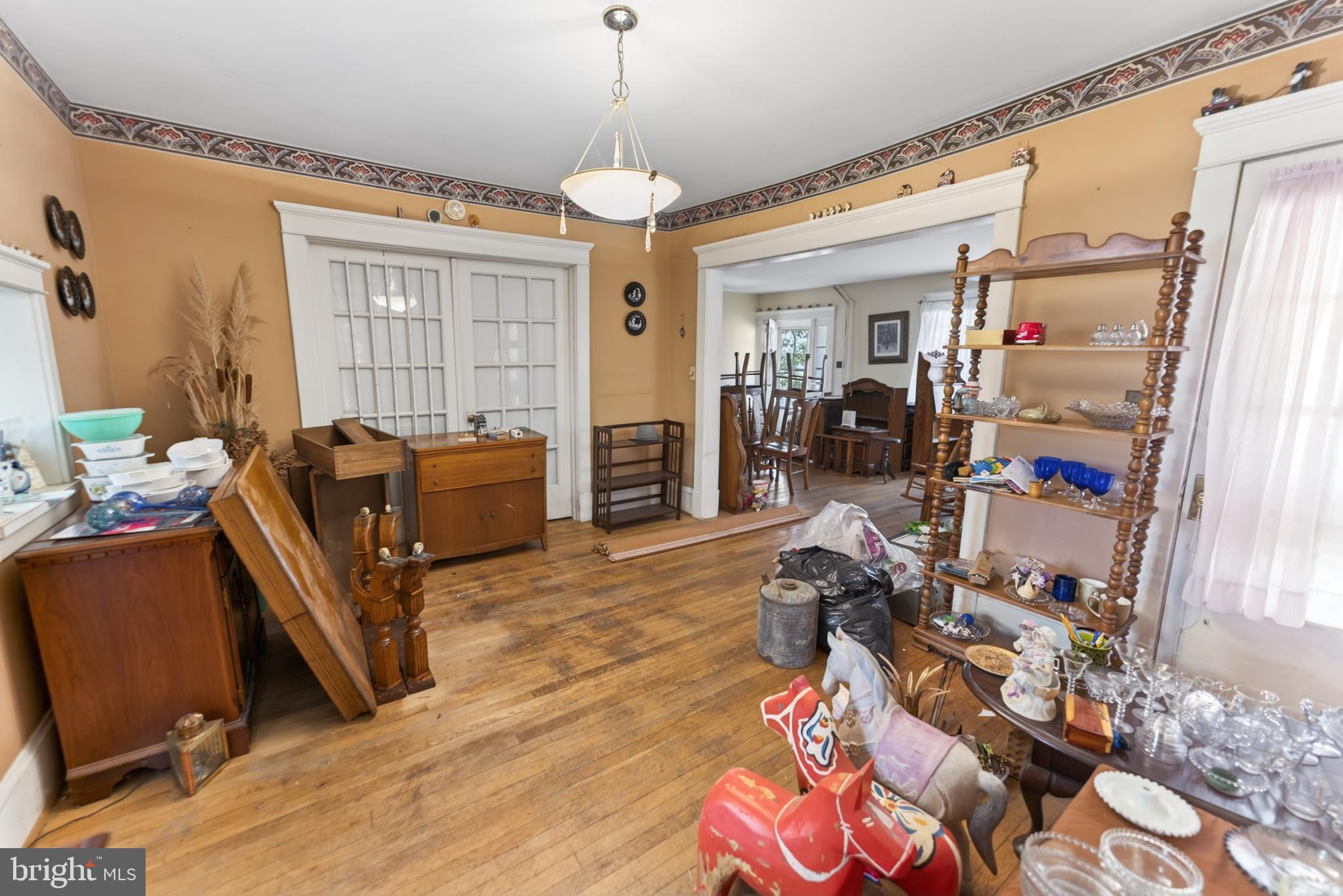 522 Market Street Denton, MD 21629 - Photo 25 of 49 a room with furniture a chandelier and a window