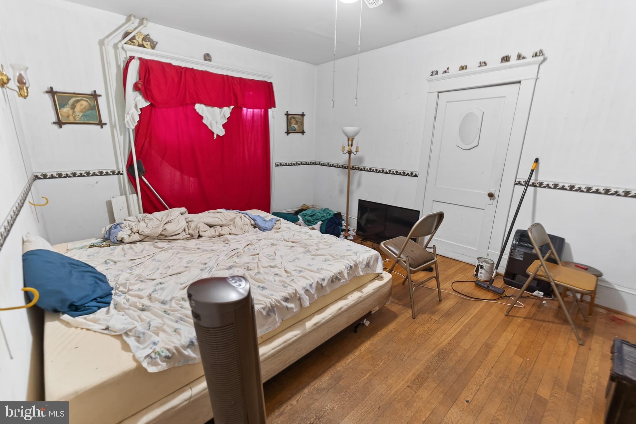 522 Market Street Denton, MD 21629 - Photo 34 of 49 a bed sitting in a bedroom next to a window