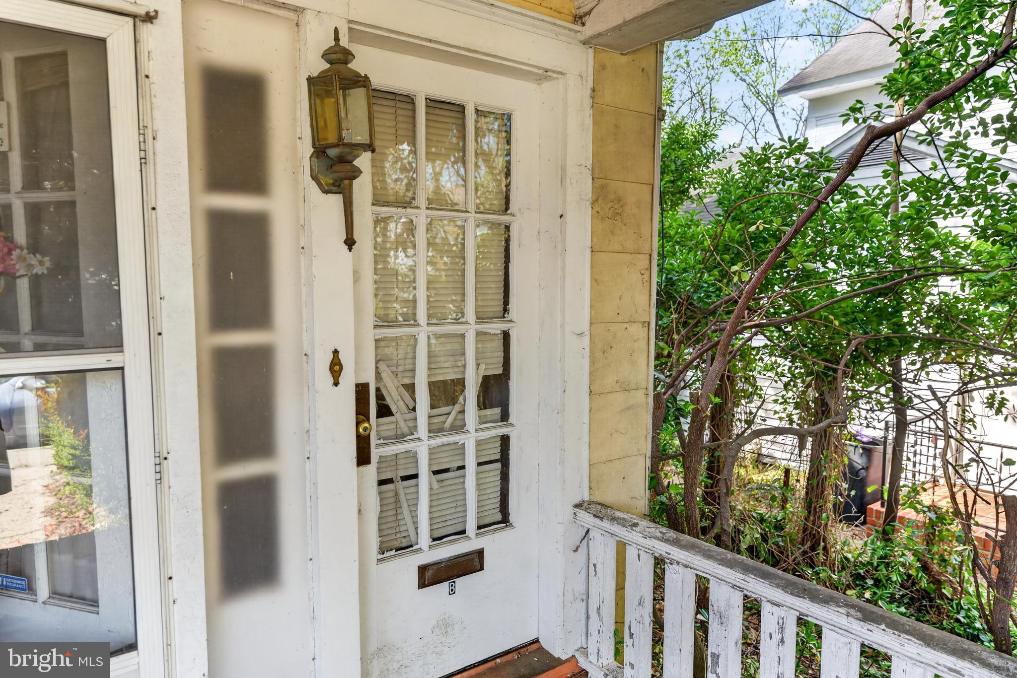 522 Market Street Denton, MD 21629 - Photo 37 of 49 a view of a balcony with wooden fence and glass door