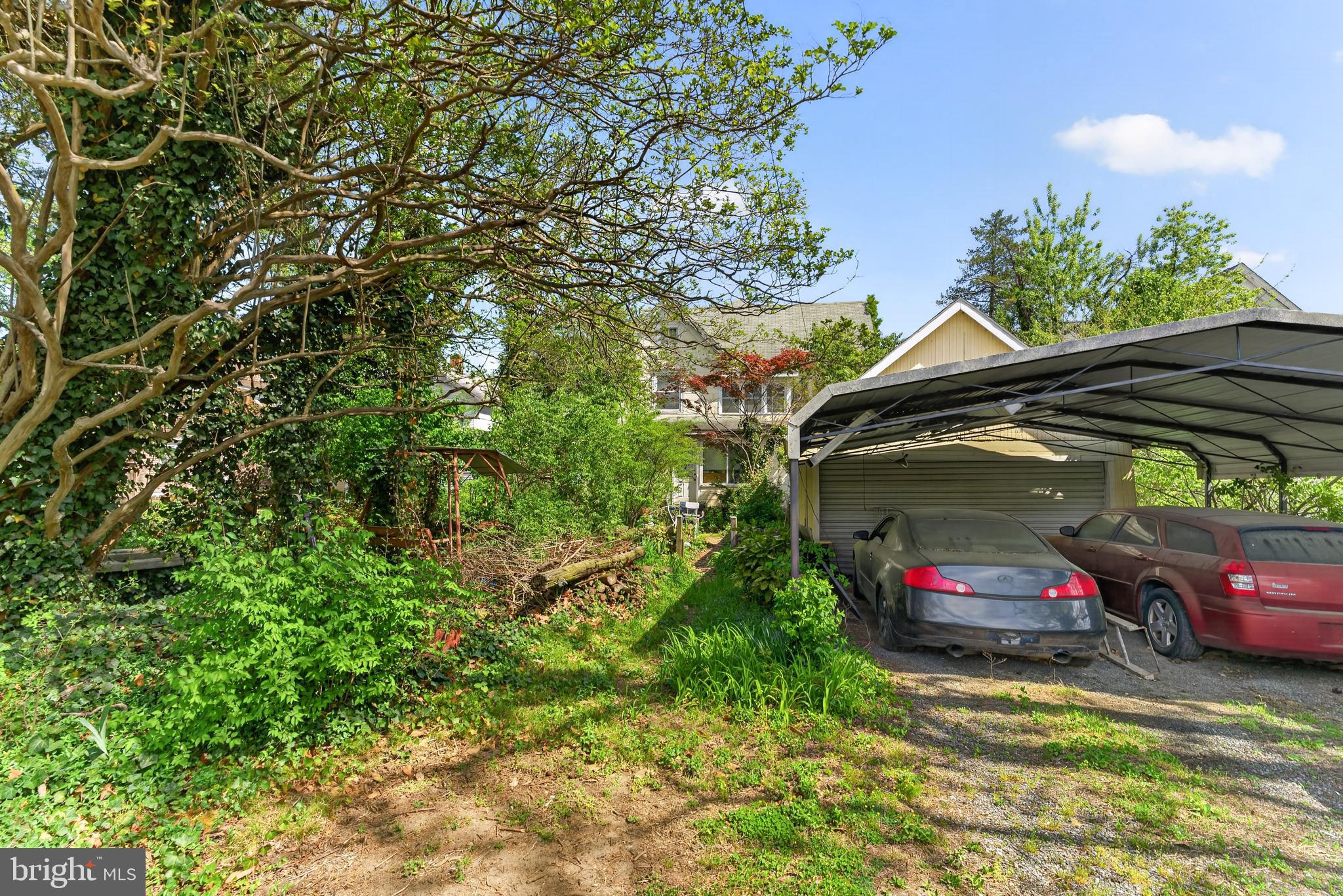 522 Market Street Denton, MD 21629 - Photo 48 of 49 a car parked in the parking lot of a house