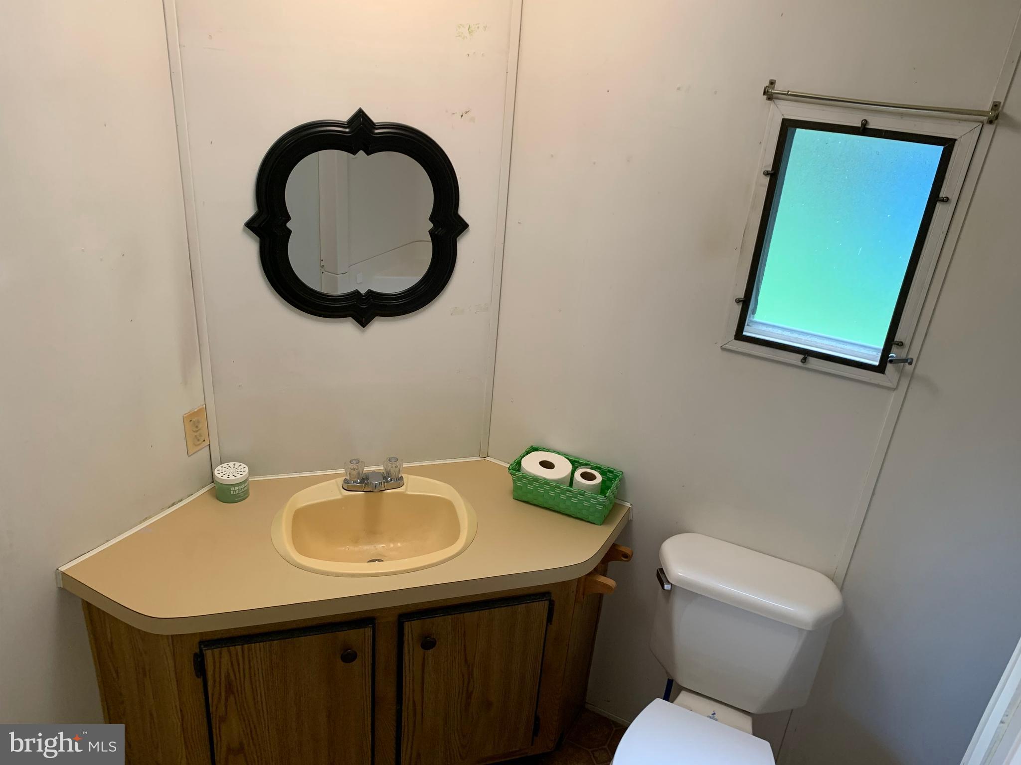 901 South Spring Garden Street, Unit 67 Carlisle, PA 17015 - Photo 16 of 26 a bathroom with a sink a toilet and a mirror