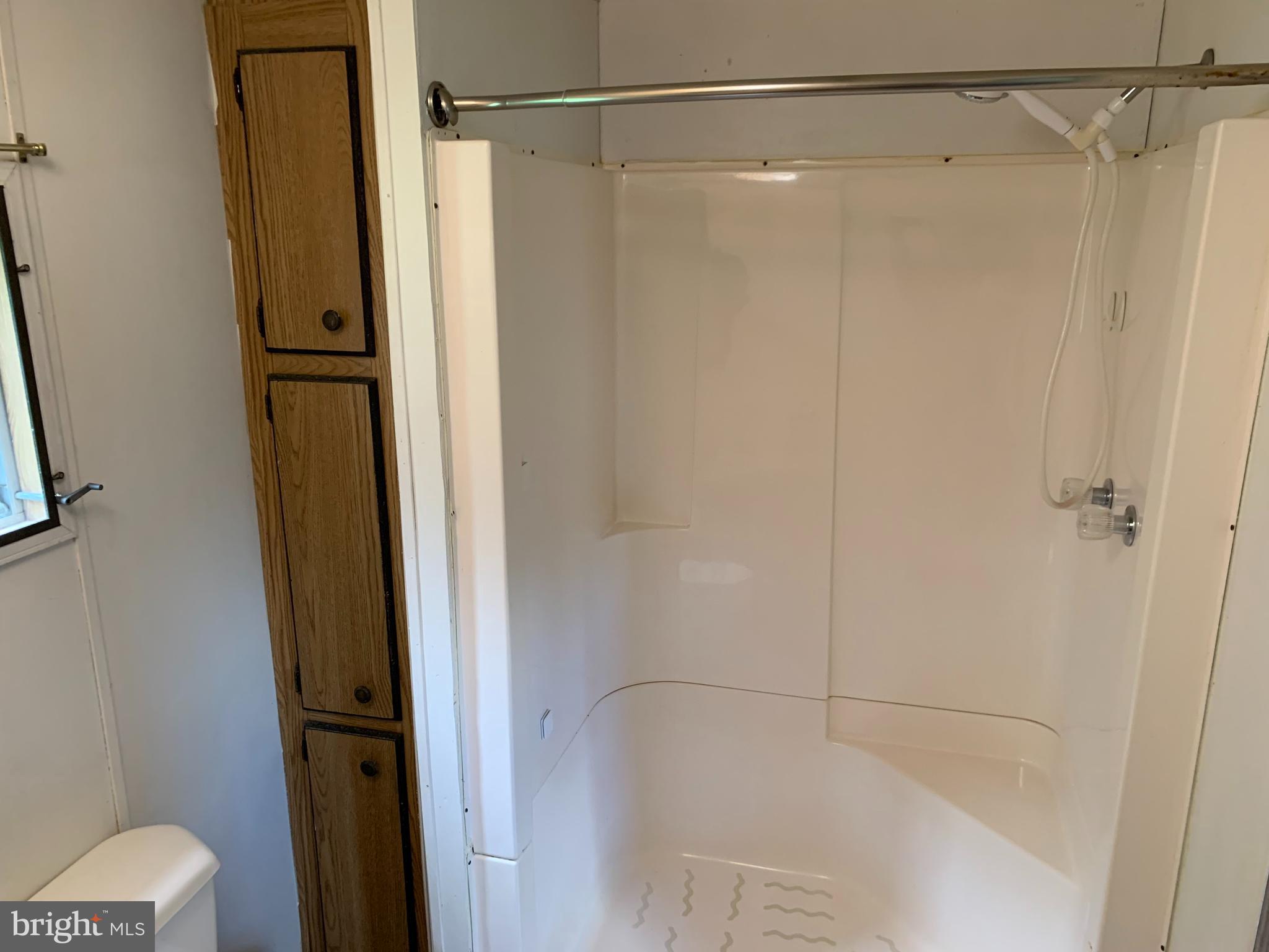 901 South Spring Garden Street, Unit 67 Carlisle, PA 17015 - Photo 17 of 26 a bathroom with a shower and a glass door