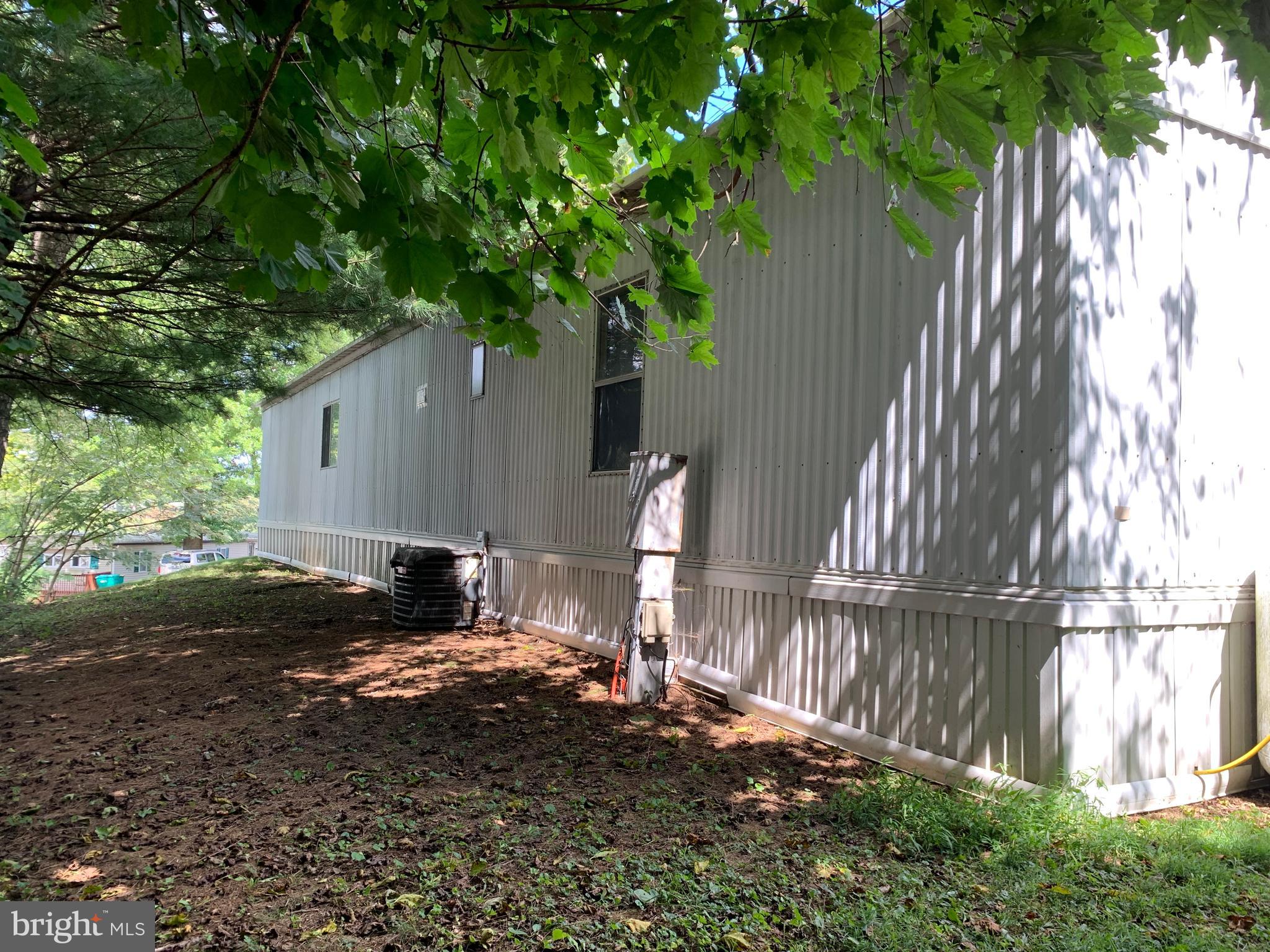 901 South Spring Garden Street, Unit 67 Carlisle, PA 17015 - Photo 3 of 26 a backyard of a house with lots of green space