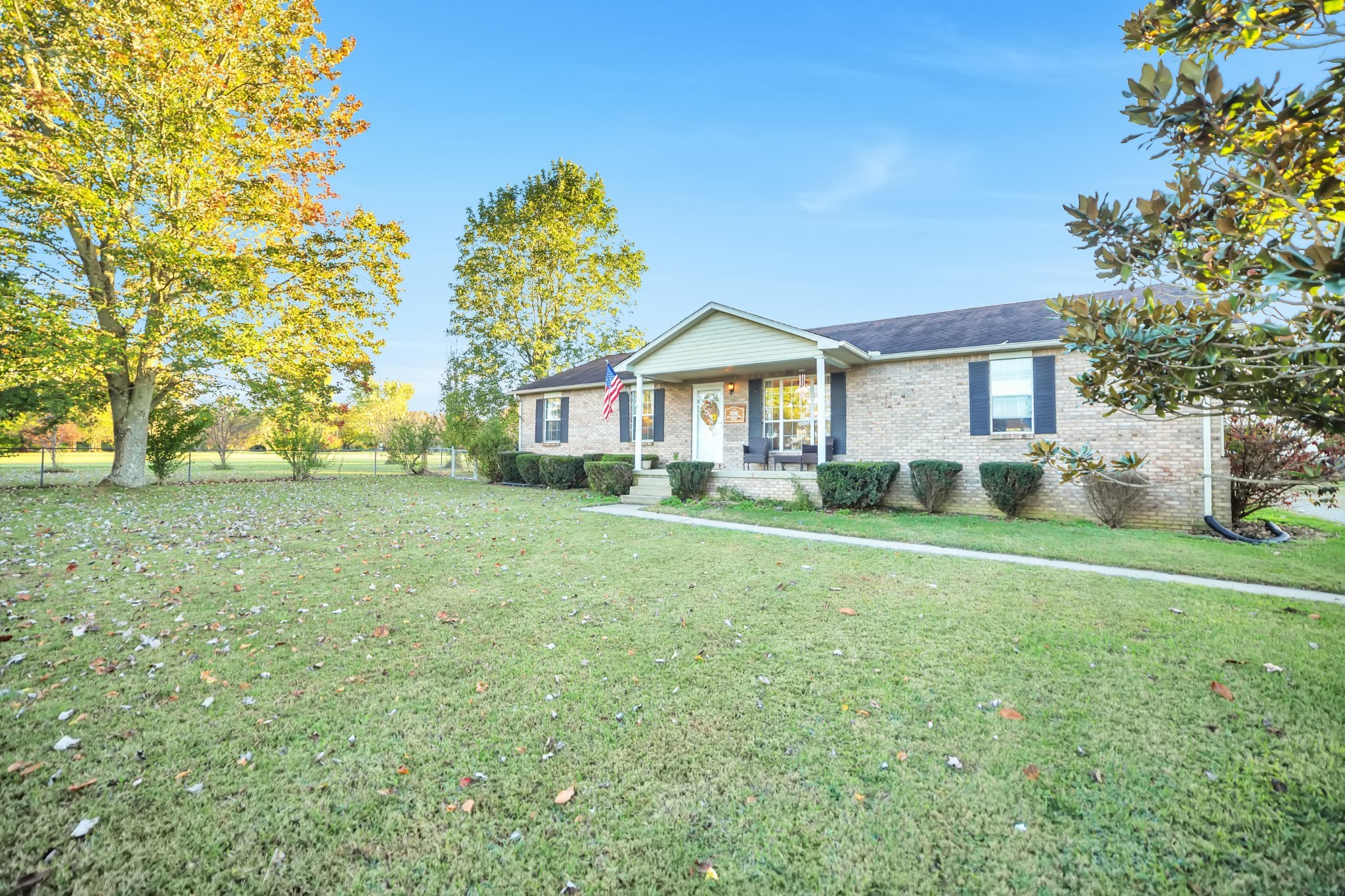 806 Old Gallatin Road Portland, TN 37148 - Photo 2 of 16 a front view of a house with a yard and trees